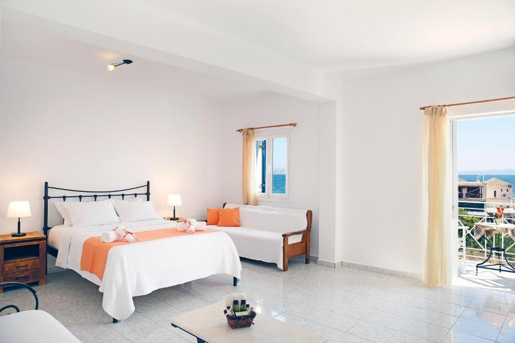 Postel nebo postele na pokoji v ubytování Agistri Apartments