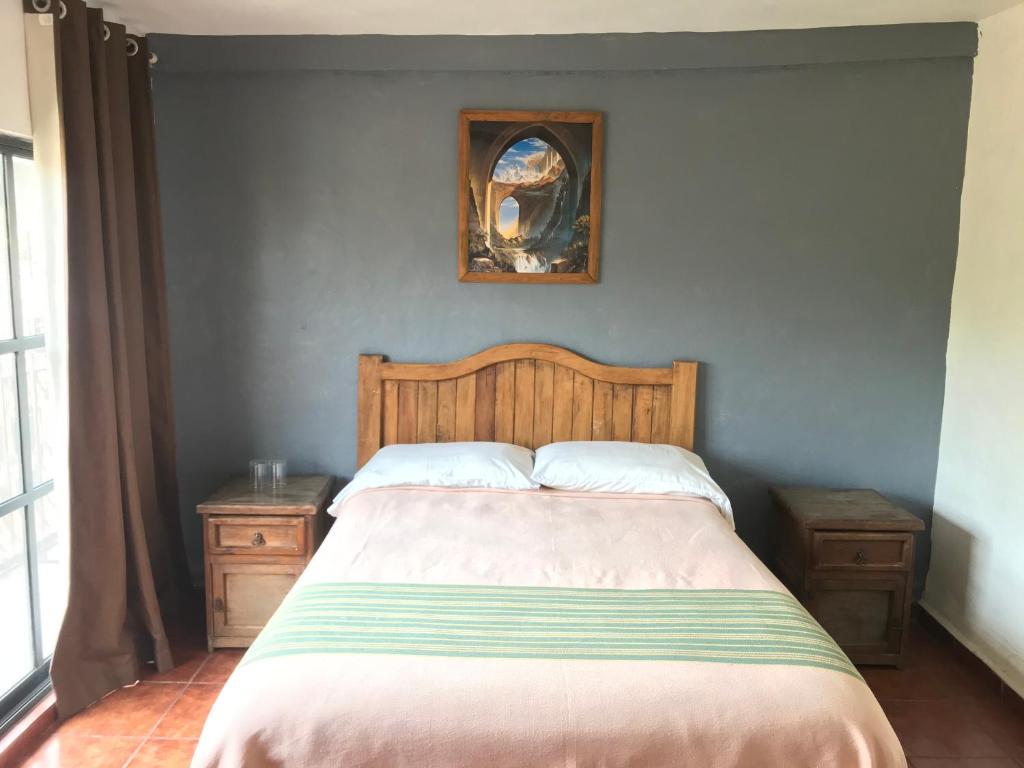 Postel nebo postele na pokoji v ubytování Posada Temazcal Santo Domingo