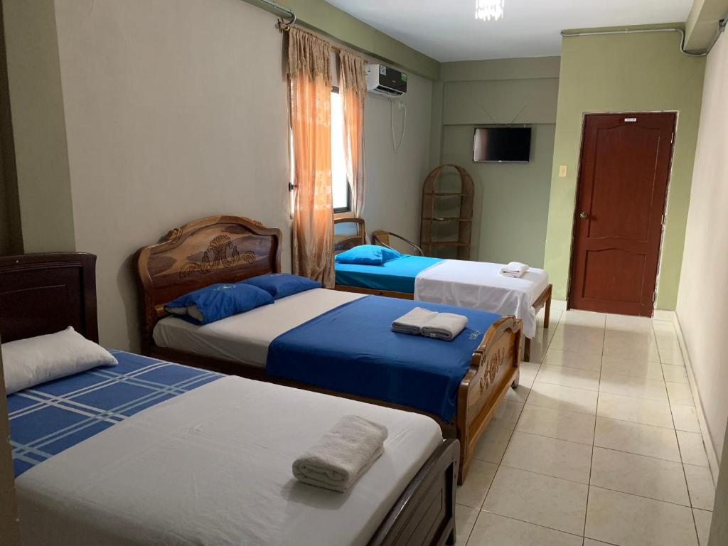 Postel nebo postele na pokoji v ubytování Residencial Turístico Rio Guayas