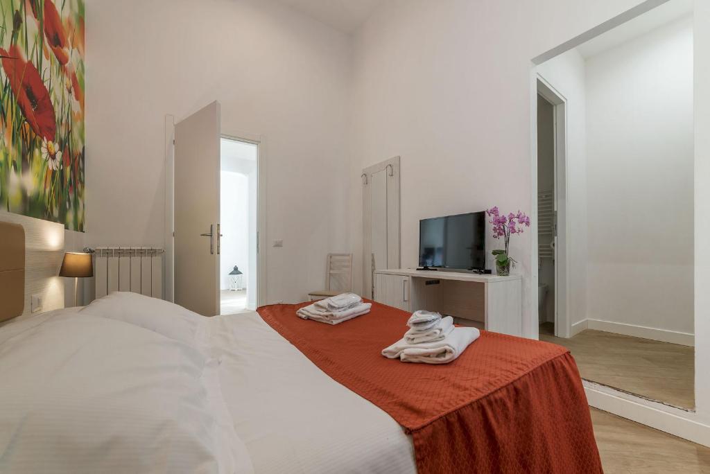 Postel nebo postele na pokoji v ubytování Hotel Mimosa Pantheon
