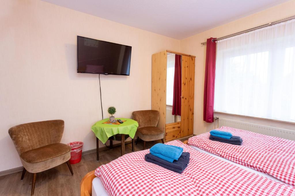 Postel nebo postele na pokoji v ubytování Rhododendronhof