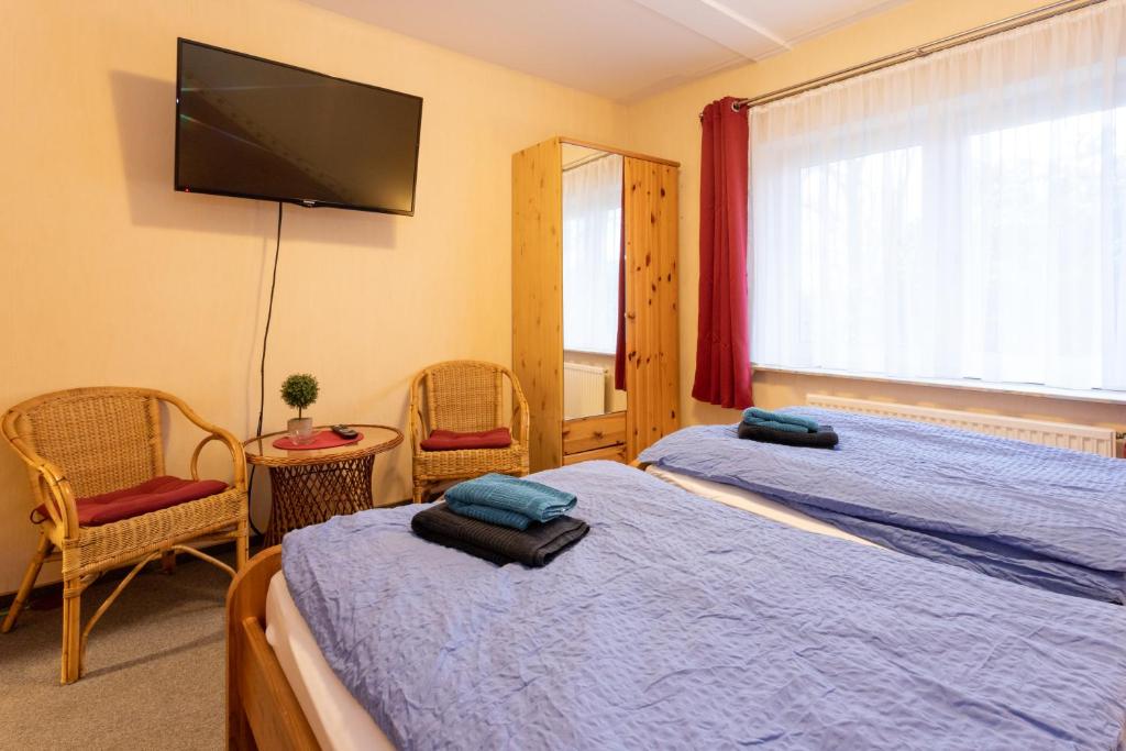 Postel nebo postele na pokoji v ubytování Rhododendronhof