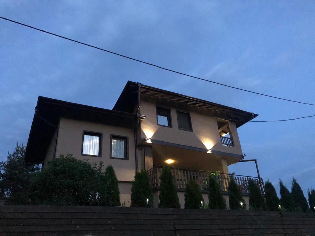 a house with lights on the side of it at Villa Monte in Velingrad
