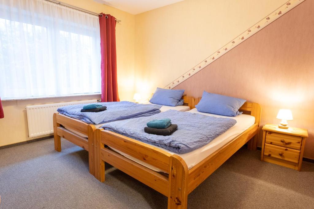 Postel nebo postele na pokoji v ubytování Rhododendronhof