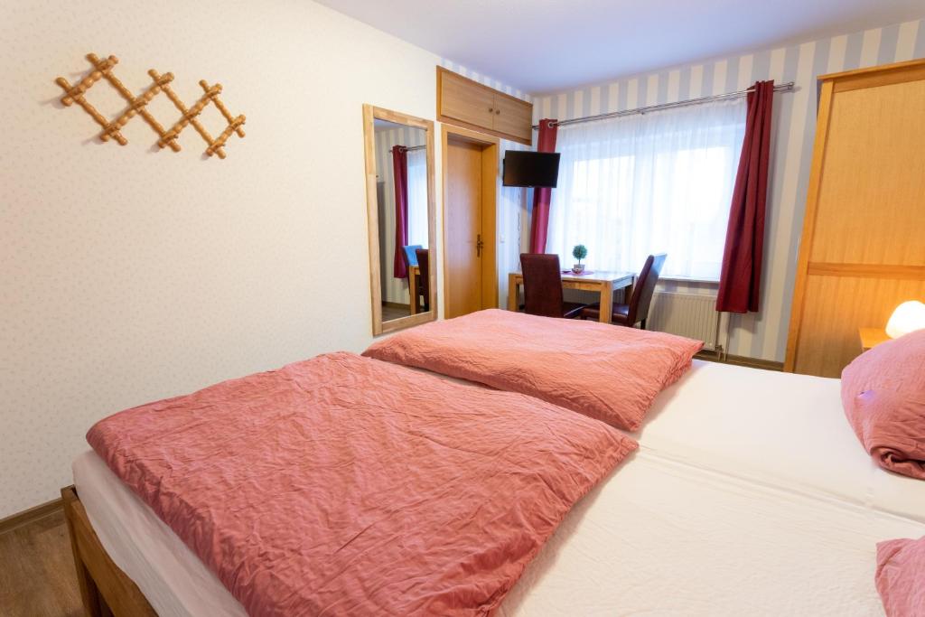 Postel nebo postele na pokoji v ubytování Rhododendronhof