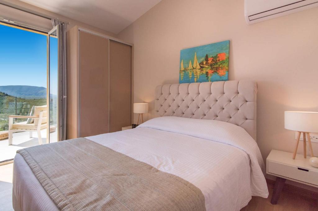 Postel nebo postele na pokoji v ubytování Kaletzia villas