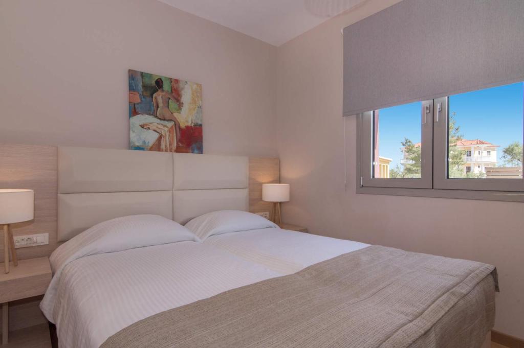 Postel nebo postele na pokoji v ubytování Kaletzia villas
