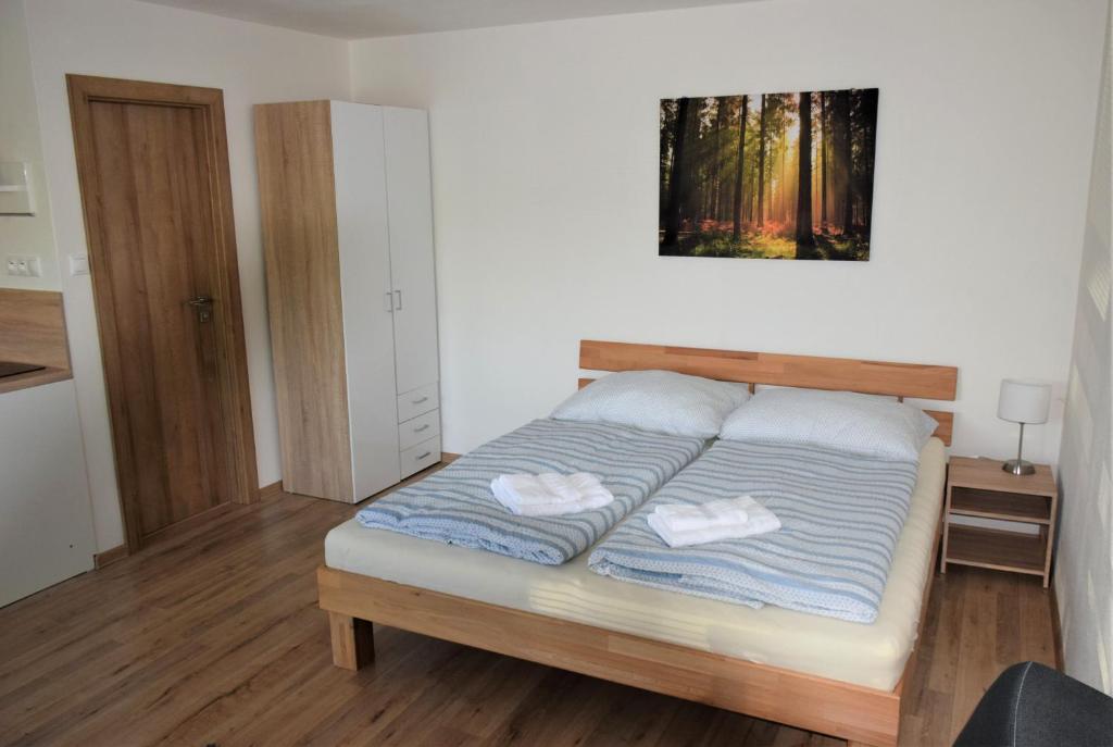 Postel nebo postele na pokoji v ubytování ADEMI Apartments