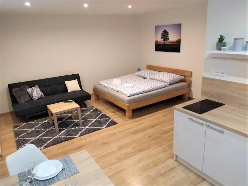 Postel nebo postele na pokoji v ubytování ADEMI Apartments