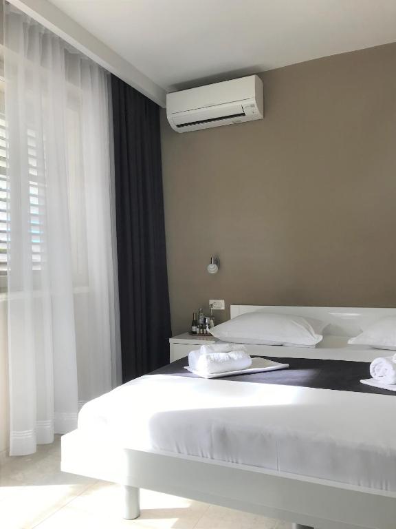 Postel nebo postele na pokoji v ubytování Berulia accommodation
