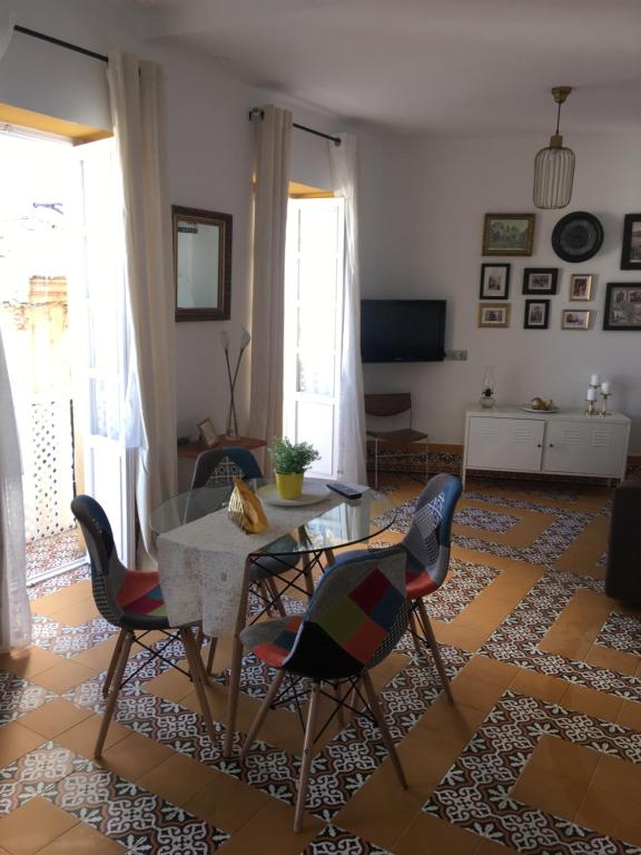 Televízia a/alebo spoločenská miestnosť v ubytovaní Casa del Mercado