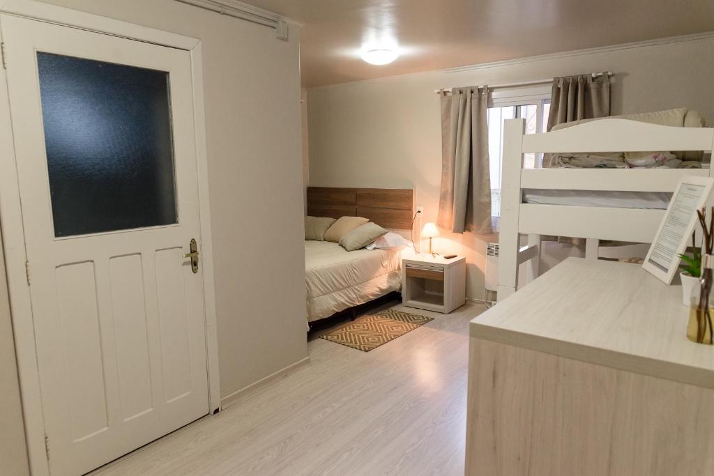 Postel nebo postele na pokoji v ubytování Hospedagem Vila Suiça Centro