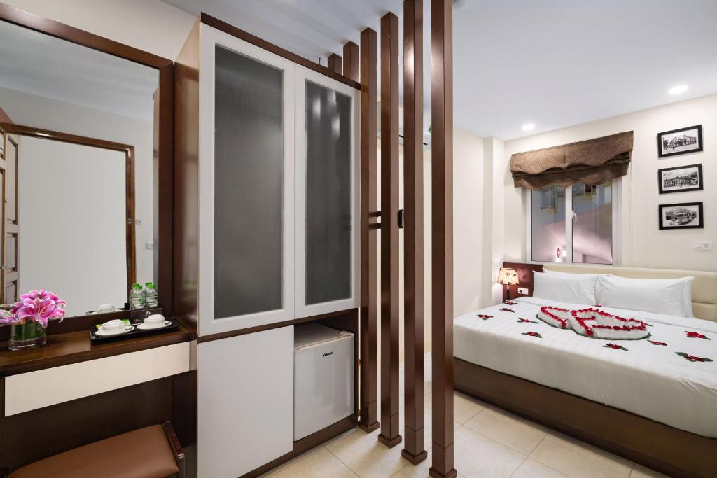 Postel nebo postele na pokoji v ubytování Dream Central Hotel & Spa - Hanoi Old Quarter
