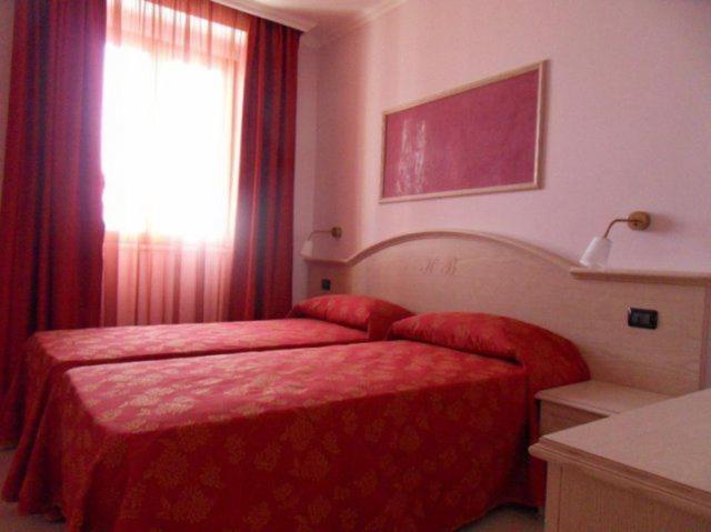 Postel nebo postele na pokoji v ubytování Hotel Belvedere