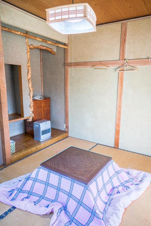 Postel nebo postele na pokoji v ubytování Ryokan Fuji Heights