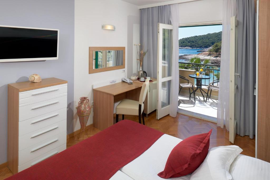 Letto o letti in una camera di Hotel Fortuna