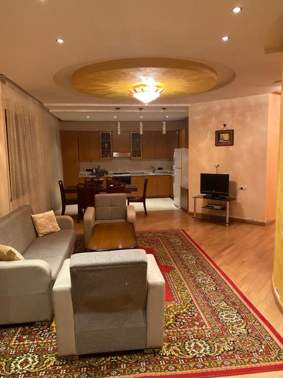 a living room with a couch and a table at House Abel in Tsaghkadzor