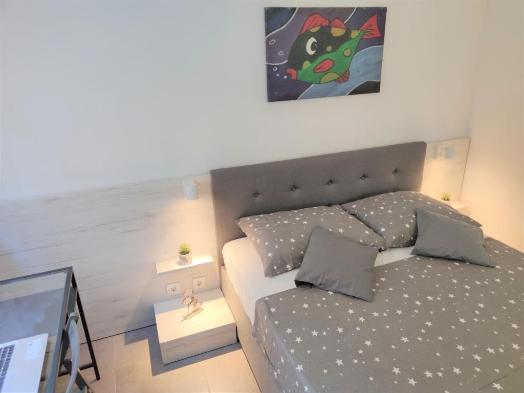 Postel nebo postele na pokoji v ubytování Apartments Rak