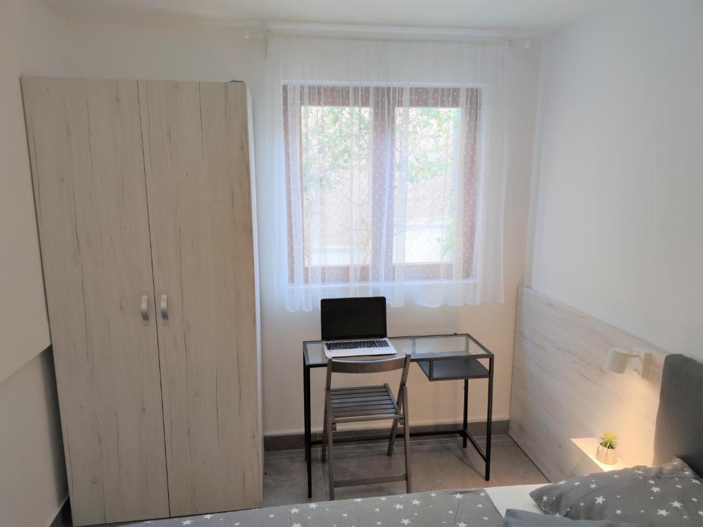 Postel nebo postele na pokoji v ubytování Apartments Rak