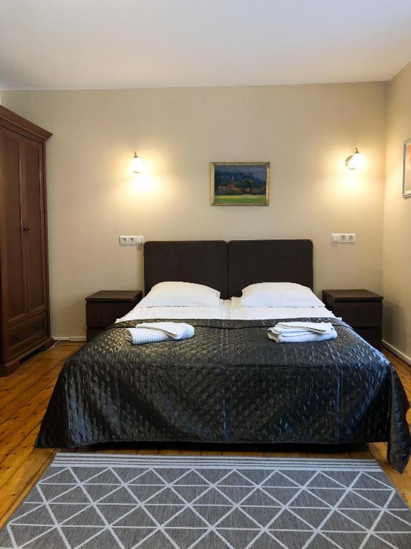 Postel nebo postele na pokoji v ubytování Apartamentai Viktorija
