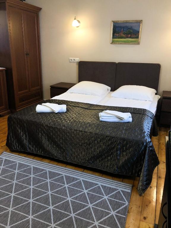 Postel nebo postele na pokoji v ubytování Apartamentai Viktorija