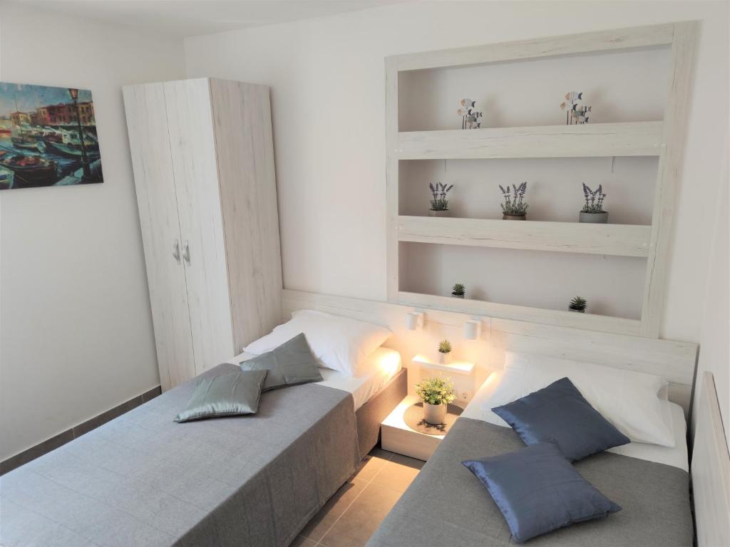 Postel nebo postele na pokoji v ubytování Apartments Rak