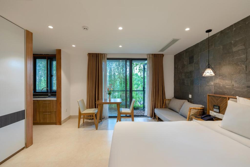 Giường trong phòng chung tại Ponte Boutique Da Nang