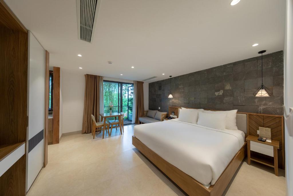 Giường trong phòng chung tại Ponte Boutique Da Nang