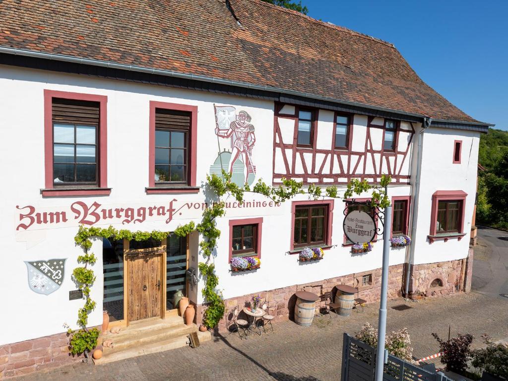 a building with a sign on the side of it at Hotel Zum Burggraf in Neuleiningen