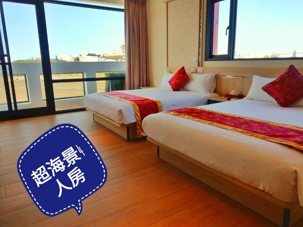 Postel nebo postele na pokoji v ubytování 海漣天海岸民宿 & 水連天海景電梯民宿 Sea Sky Coast Homestay & Shui-lian-tian Homestay