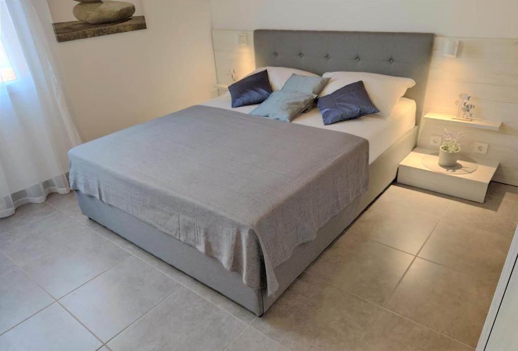 Postel nebo postele na pokoji v ubytování Apartments Rak