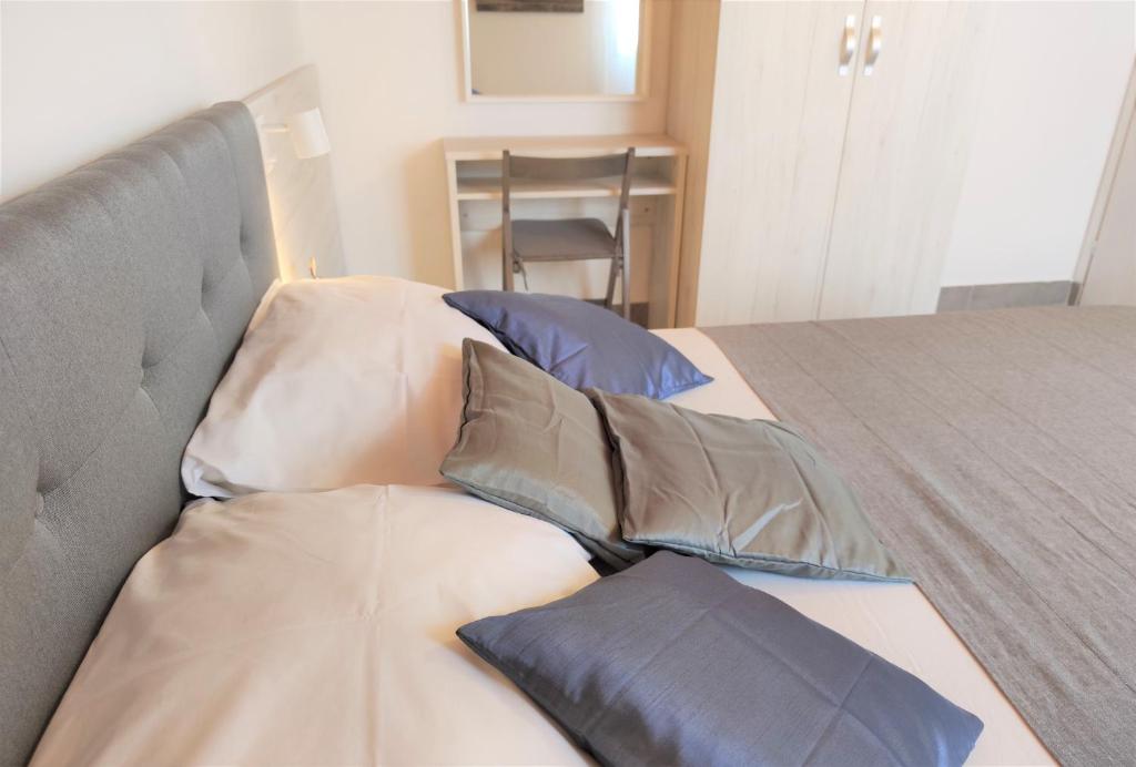 Postel nebo postele na pokoji v ubytování Apartments Rak