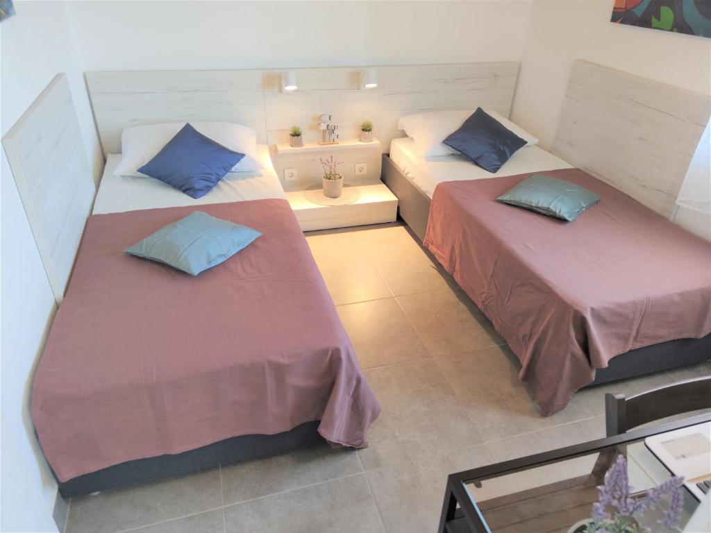 Postel nebo postele na pokoji v ubytování Apartments Rak