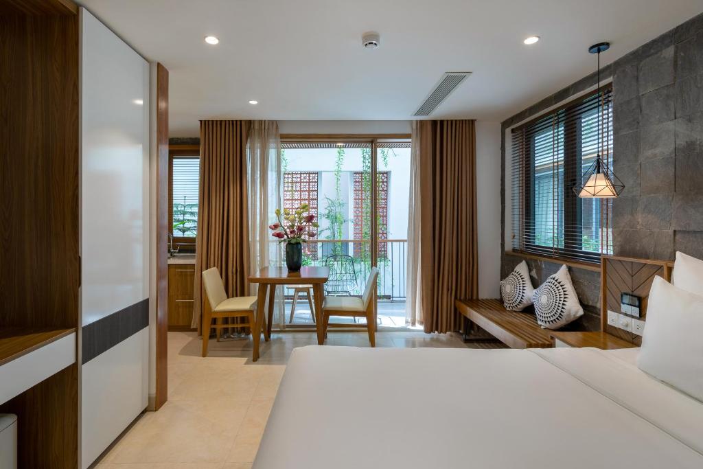 Giường trong phòng chung tại Ponte Boutique Da Nang