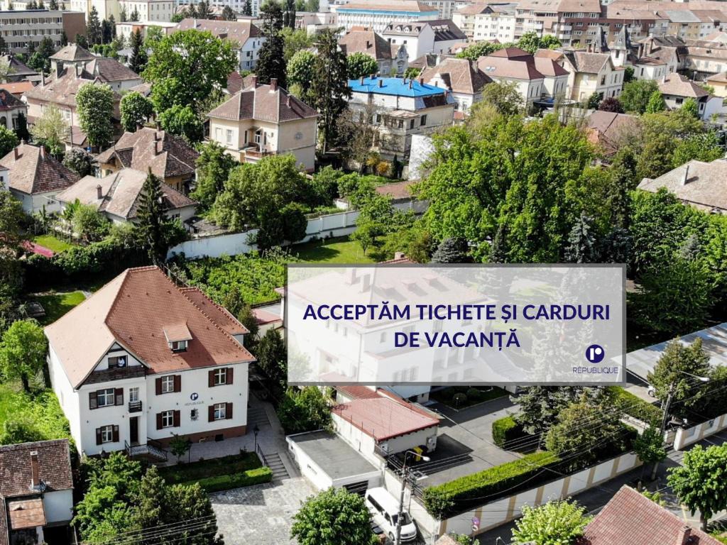 an overhead view of a city with a sign at Republique in Sibiu