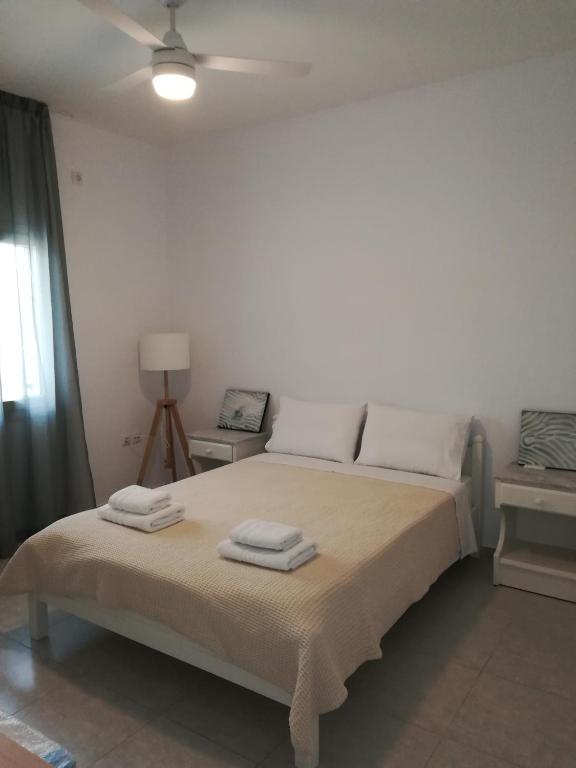 Posteľ alebo postele v izbe v ubytovaní Moschoula Studios