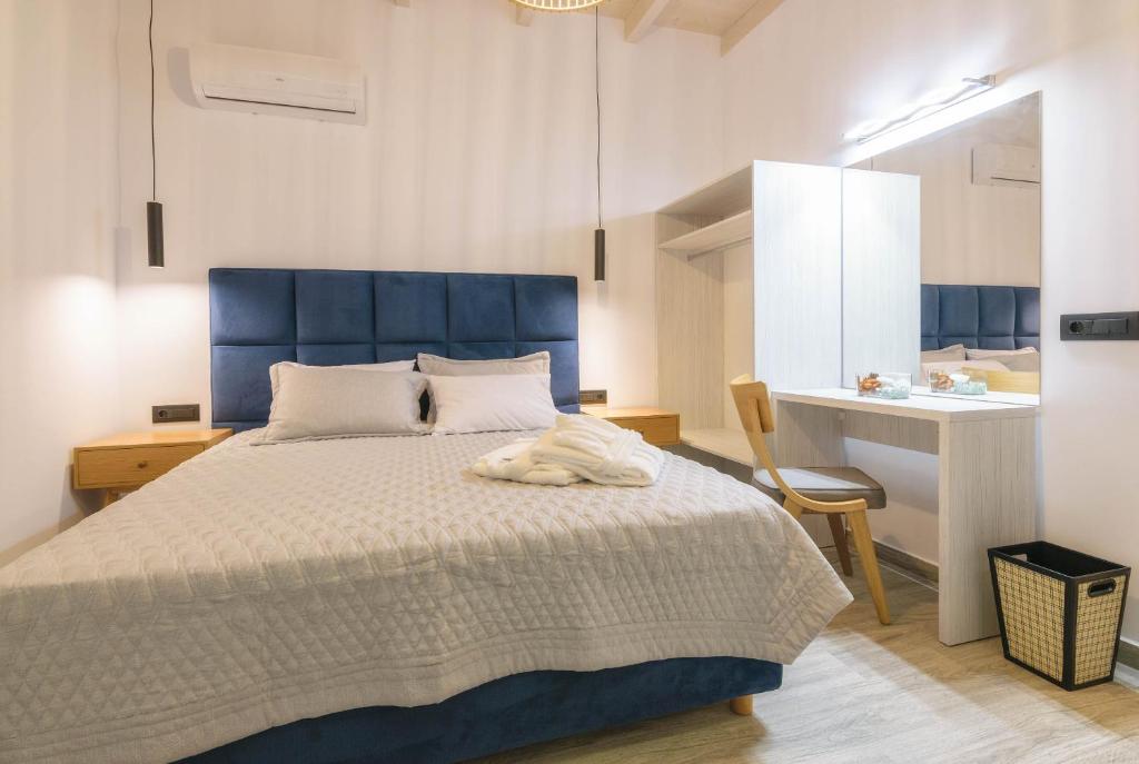 Postel nebo postele na pokoji v ubytování AKEA VILLAS
