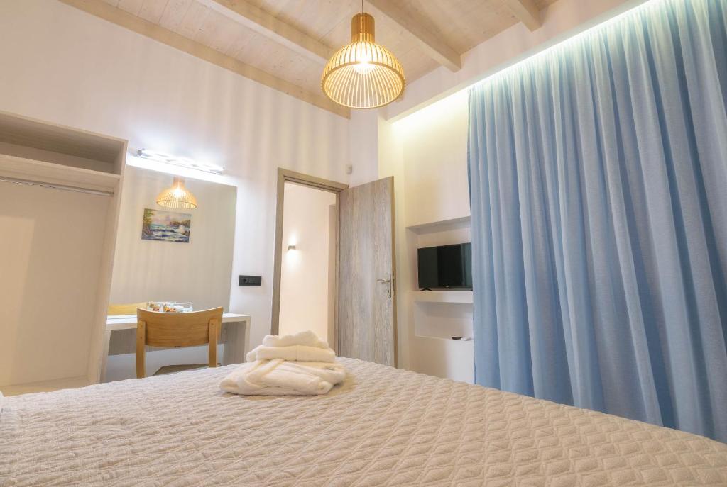 Postel nebo postele na pokoji v ubytování AKEA VILLAS