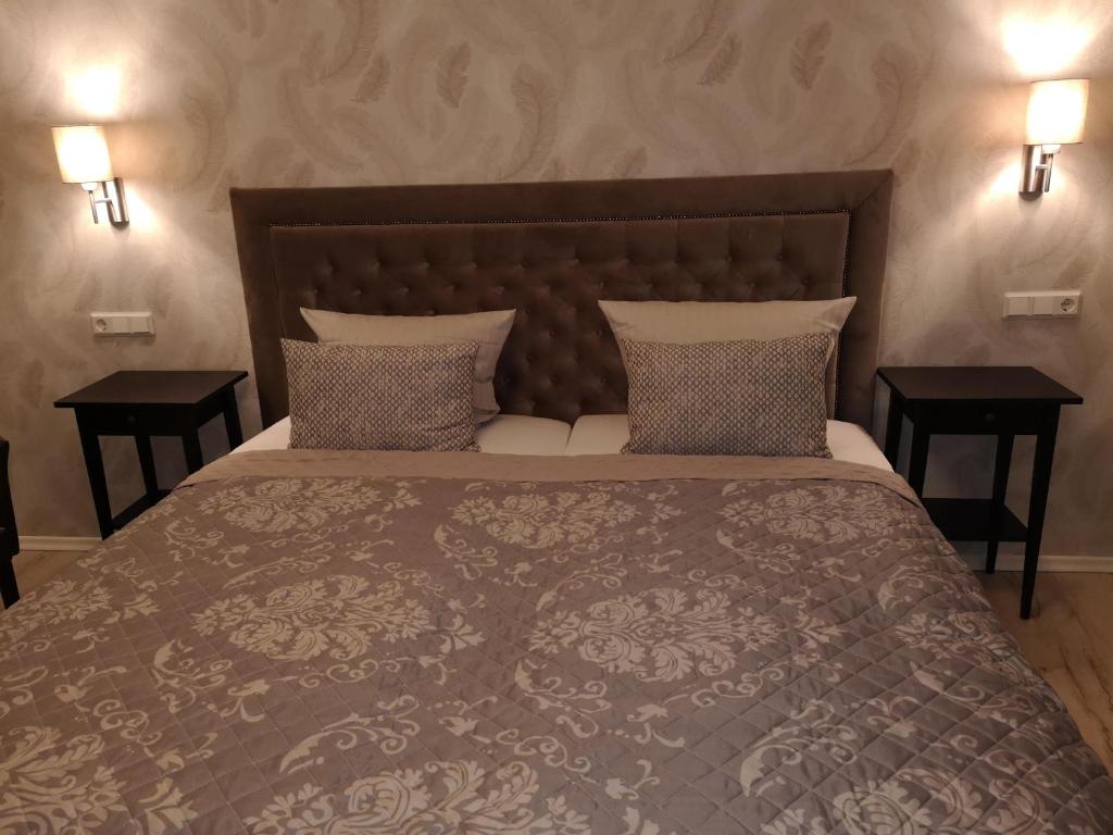 Postel nebo postele na pokoji v ubytování Hotel Löhr