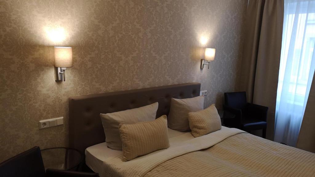 Postel nebo postele na pokoji v ubytování Hotel Löhr