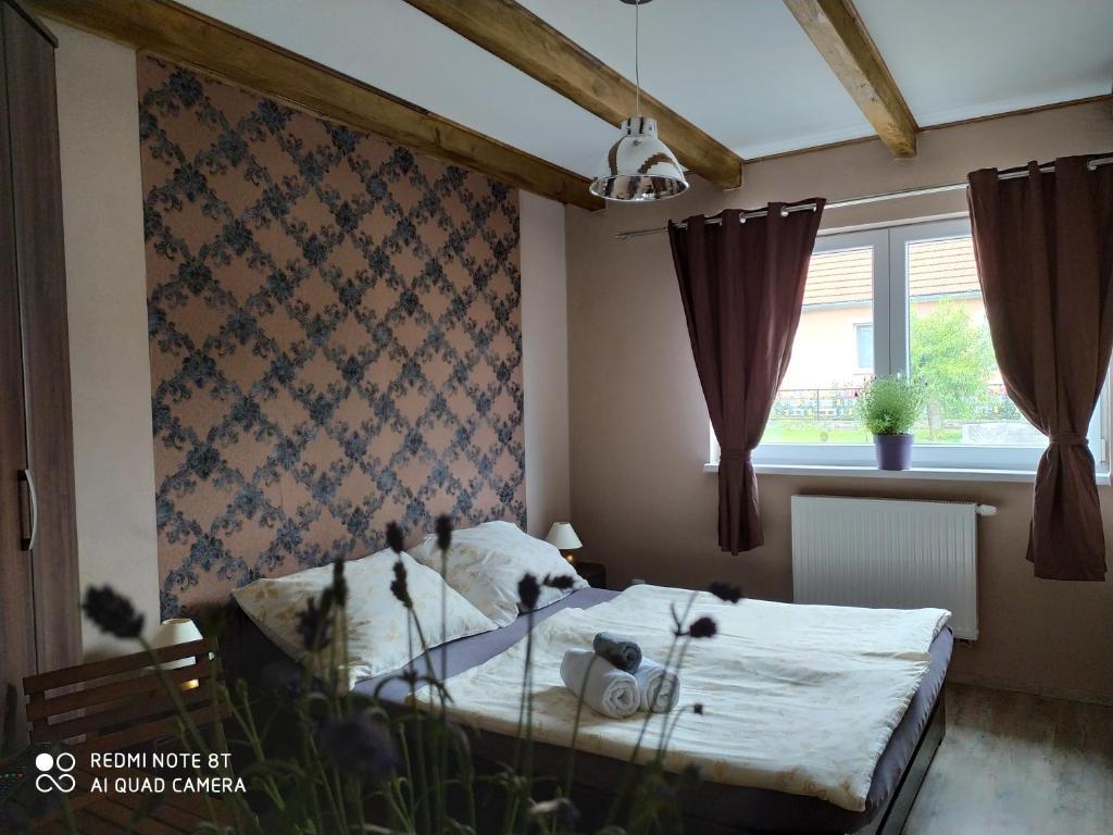 Postel nebo postele na pokoji v ubytování Penzion Levandule a Palava