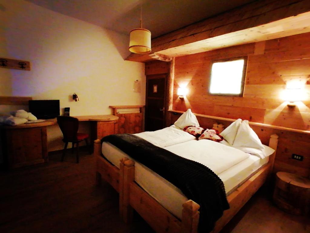 Postel nebo postele na pokoji v ubytování Hotel Rio Bianco