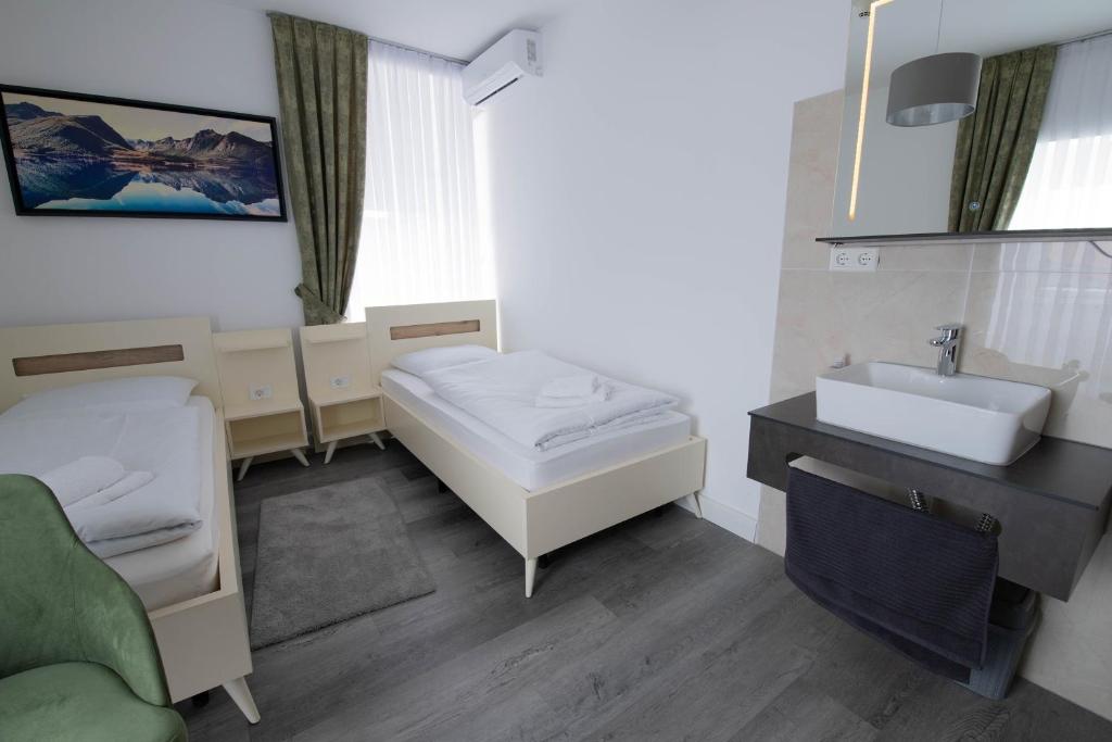 Postel nebo postele na pokoji v ubytování Heidepension Bispingen