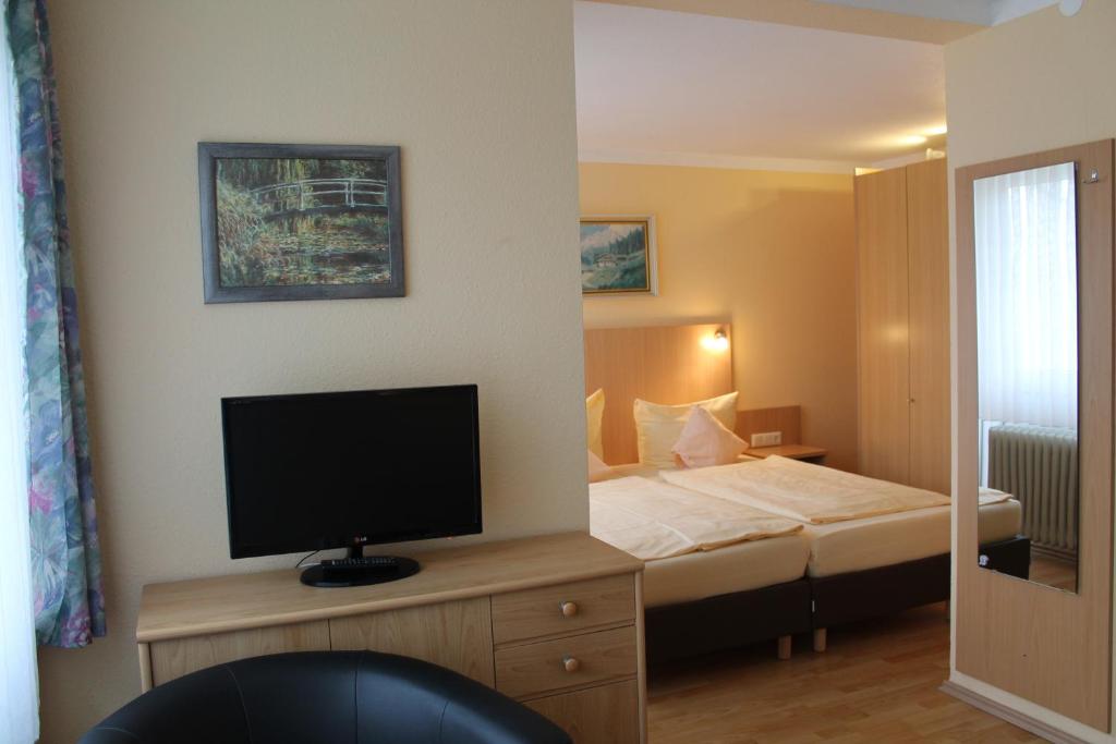 Postel nebo postele na pokoji v ubytování Hotel Brigitte