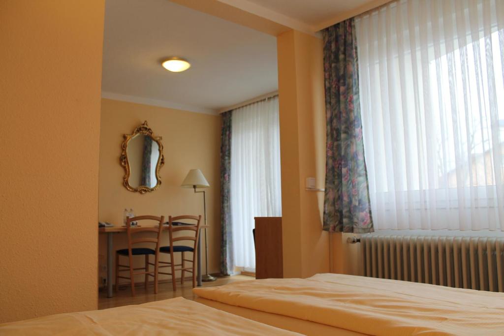 Postel nebo postele na pokoji v ubytování Hotel Brigitte