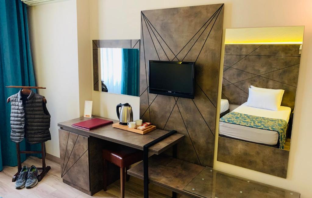 TV a/nebo společenská místnost v ubytování Hostapark Hotel