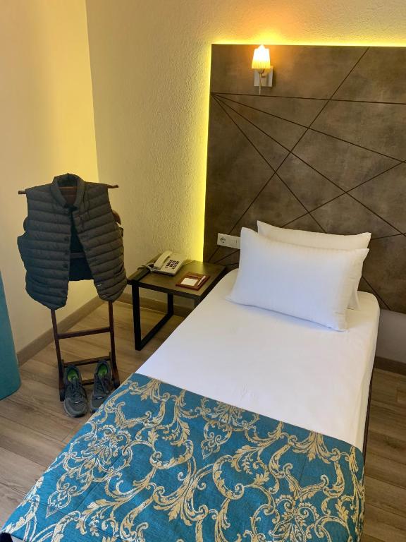 Postel nebo postele na pokoji v ubytování Hostapark Hotel