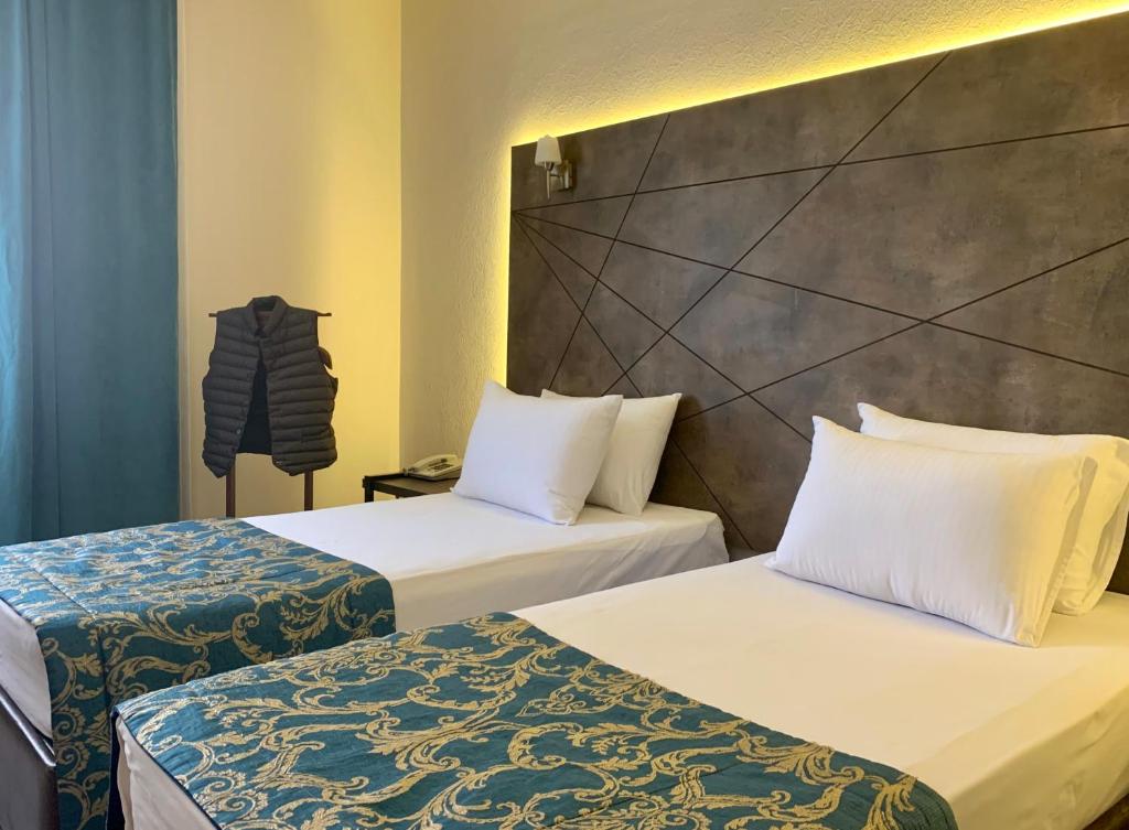 Postel nebo postele na pokoji v ubytování Hostapark Hotel