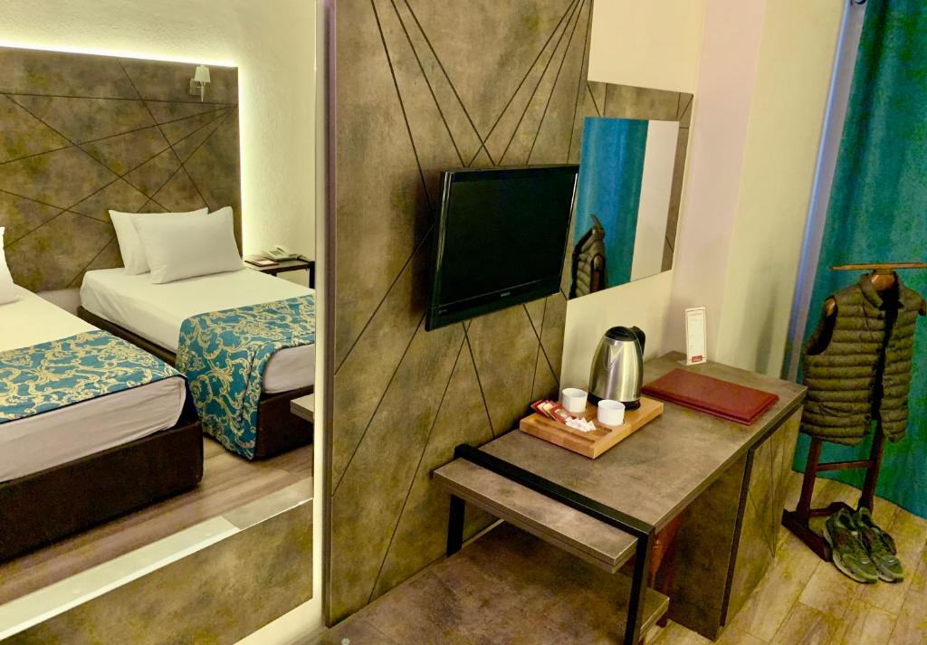 Postel nebo postele na pokoji v ubytování Hostapark Hotel