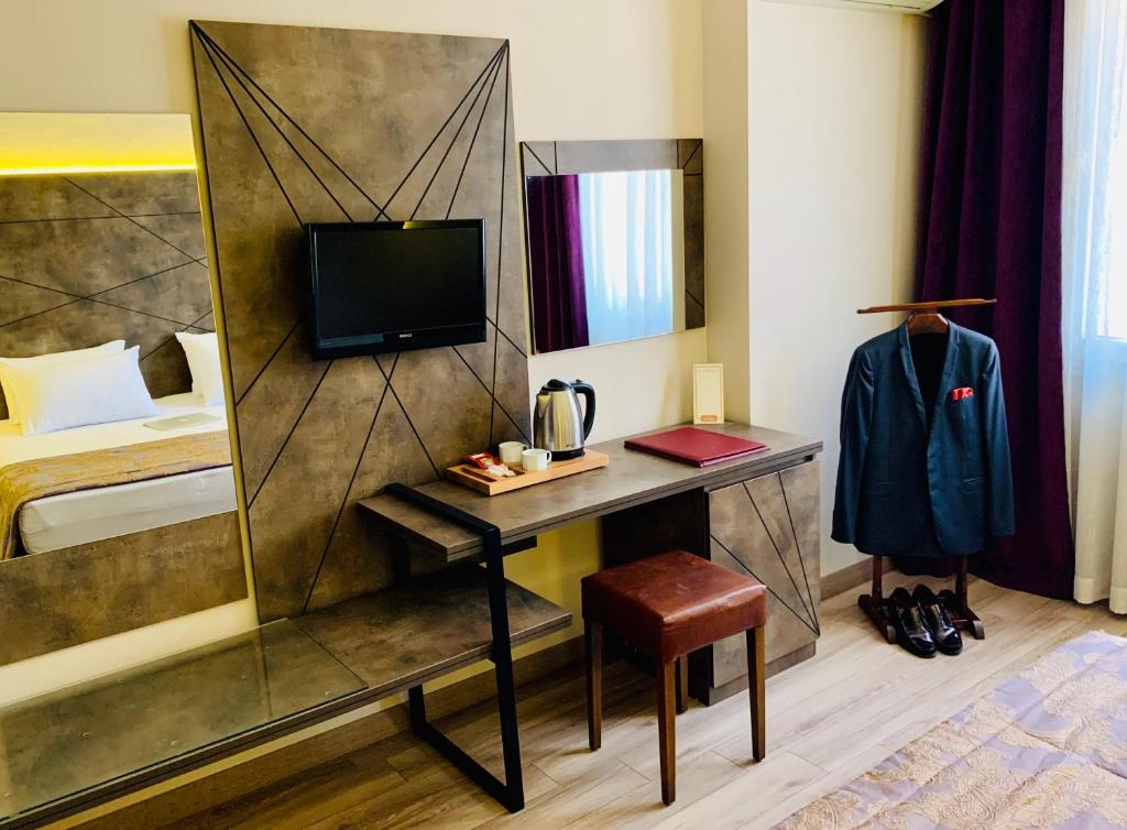 TV a/nebo společenská místnost v ubytování Hostapark Hotel